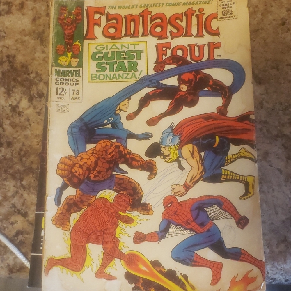 Marvel Fantastic Four Comic Cover with Red, Blue, Orange, Yellow Accents